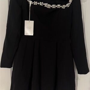 Elegant Black Dress with Floral Embellishments